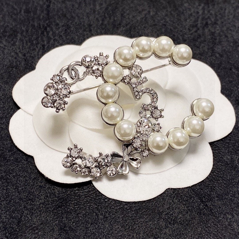 Ch**el brooches